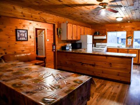 The open-concept kitchen and living area at Bear Lodge provide a welcoming space.