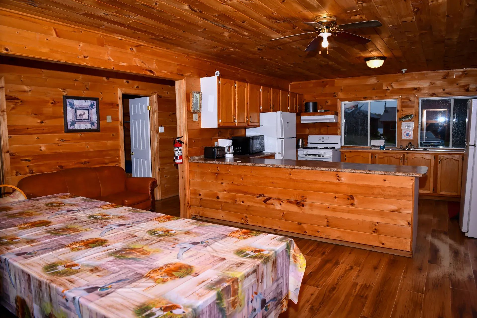 The Bear Lodge living area includes a fully equipped kitchen open to the dining room.