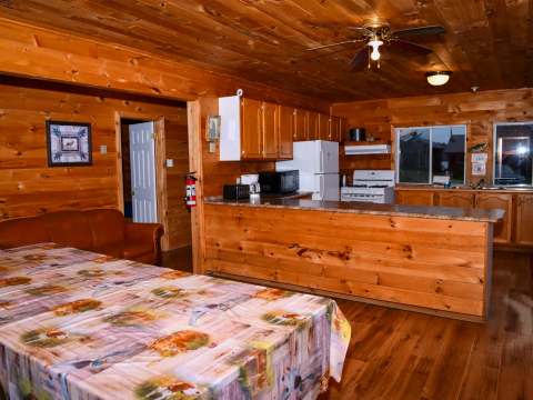 The Bear Lodge living area includes a fully equipped kitchen open to the dining room.