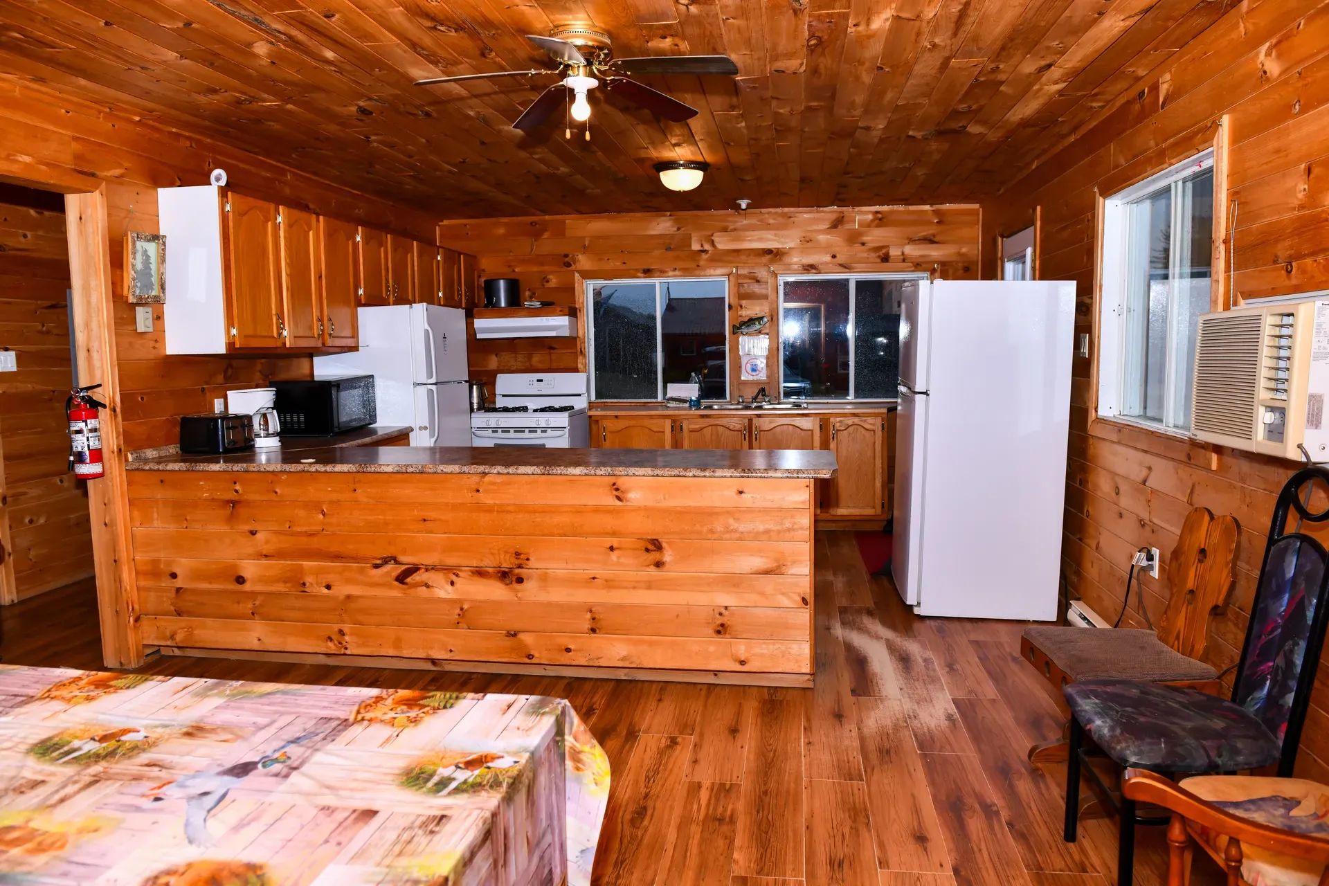 The equipped kitchen offers a large counter and an open space for your meals.
