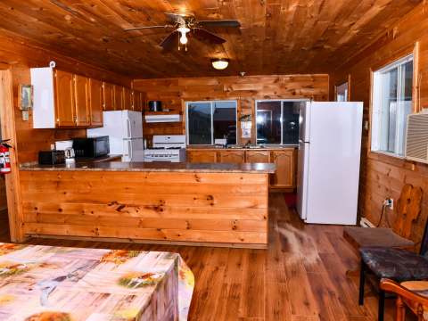 The equipped kitchen offers a large counter and an open space for your meals.