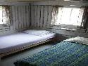 View of the rustic bedroom inside cabin number seven.