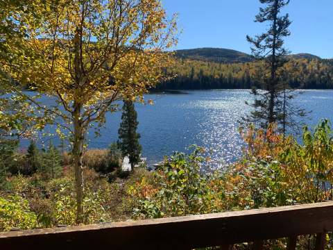 View of the lake and colorful trees from the cottage deck.