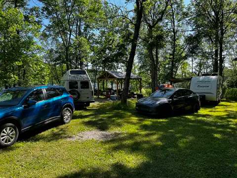 Shaded camping site with outdoor shelter for your nature getaways.