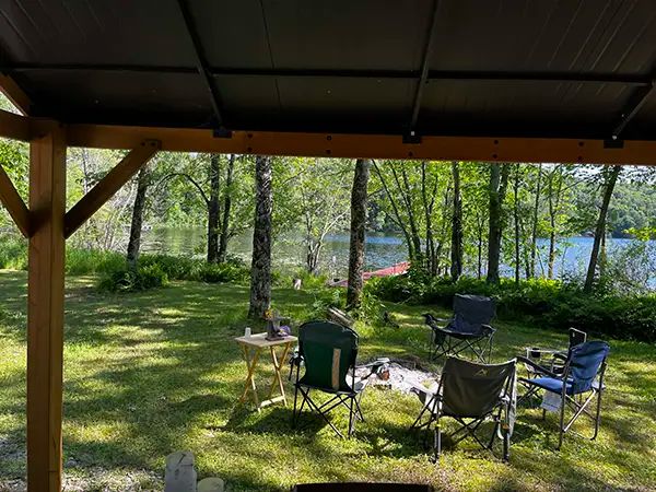 View of the lake and relaxation area from the campsite shelter.