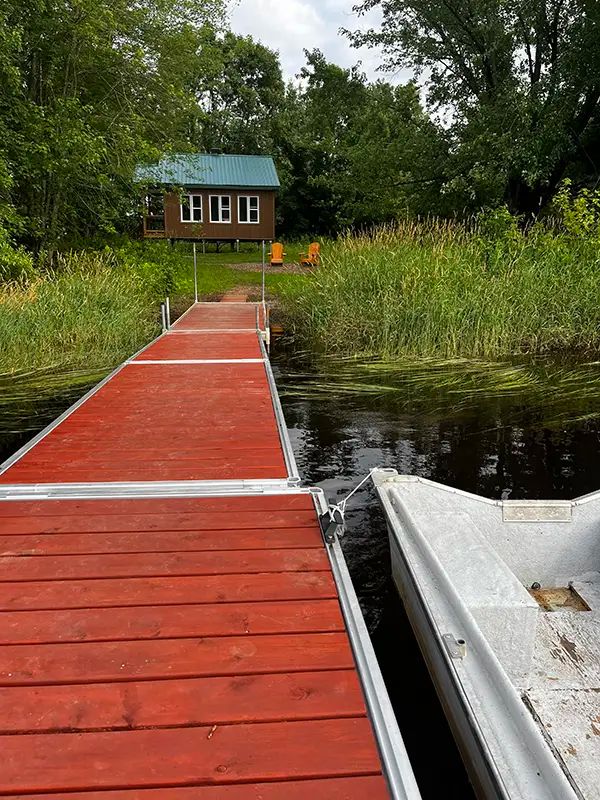 View of the cottage from the dock by the lake.
