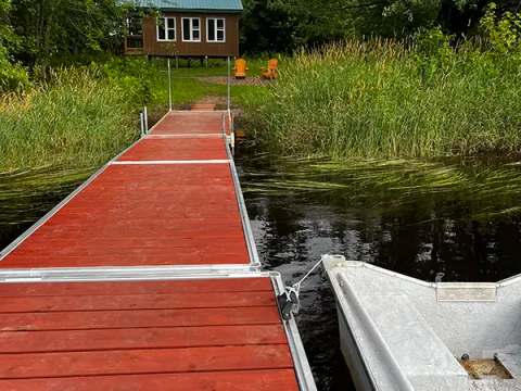 View of the cottage from the dock by the lake.