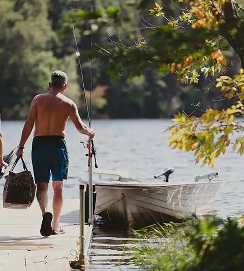 Anglers heading out on the water at Escapade Kiamika, Laurentides, Quebec