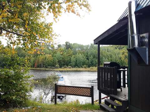 View of the dock and lake from the Avalanche-Nordique cottage deck.
