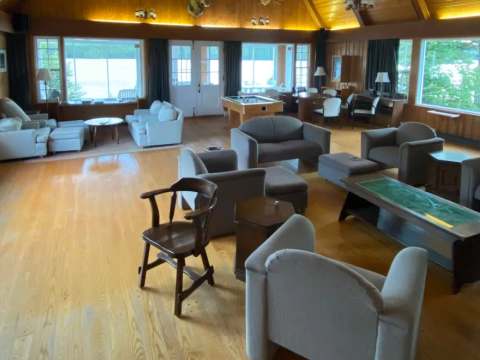The spacious lounge at the Manoir offers multiple seating areas and a pool table.