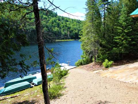 View of the dock and boats from the cabin's porch.