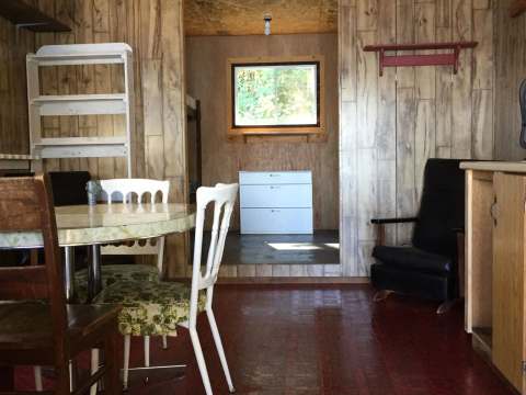 Dining area and relaxation space inside the Benson cabin.