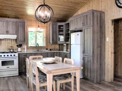 The equipped kitchen and dining area of cabin number 9.