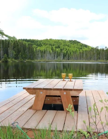 Enjoy the view of the lake from the table set up on the cabin dock.