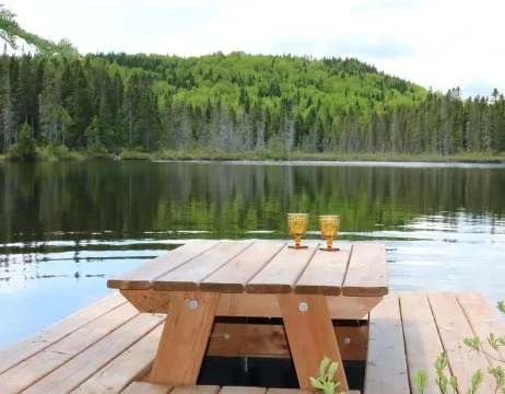 Enjoy the view of the lake from the table set up on the cabin dock.