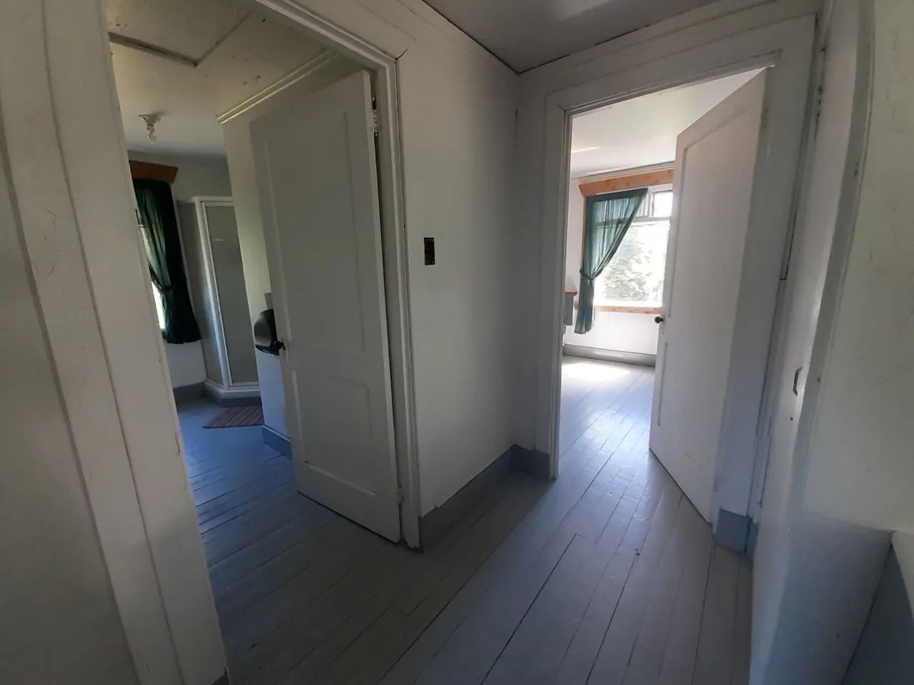 View of the hallway leading to the various rooms of the cottage.