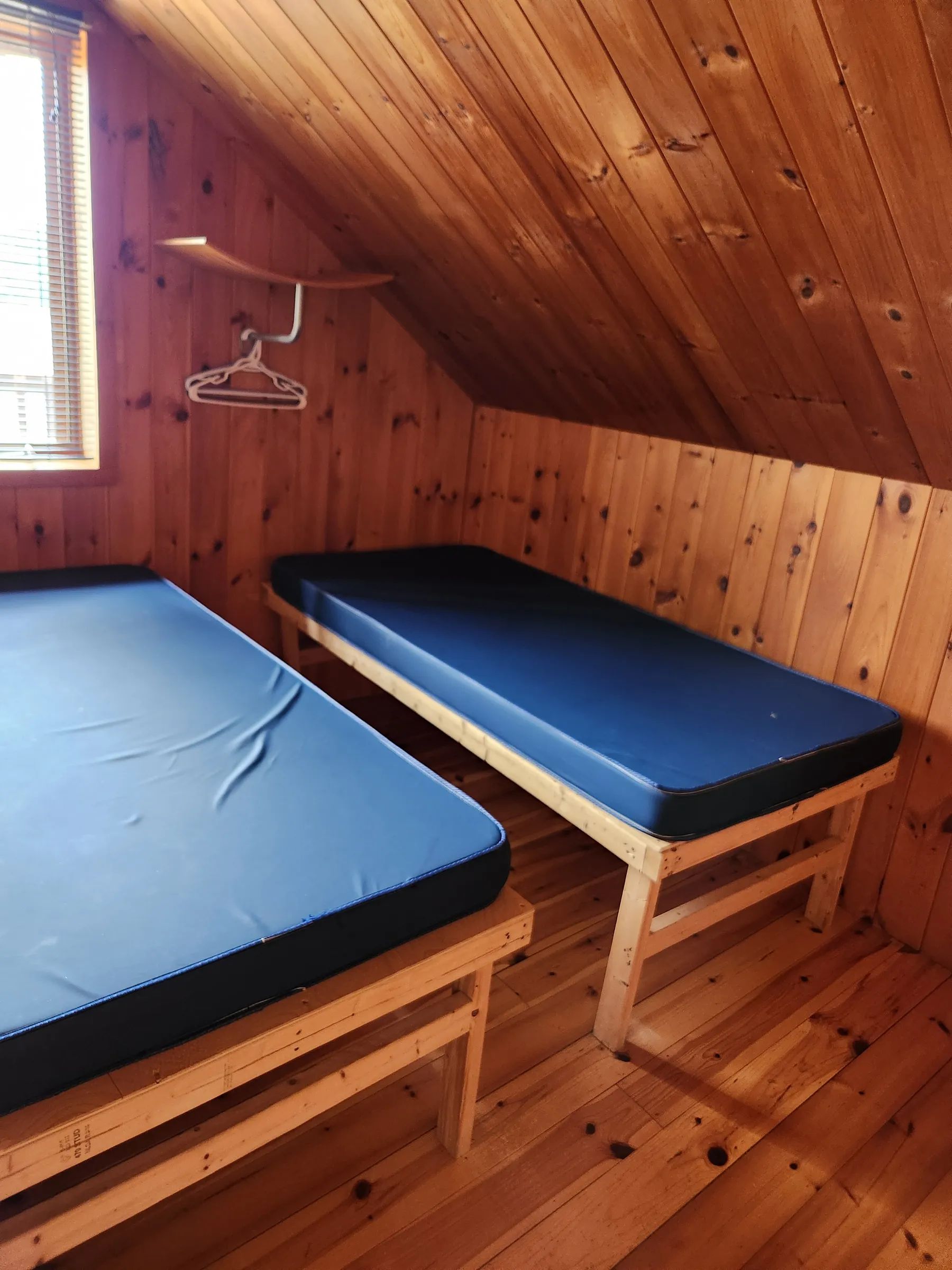 View of the wooden bunk beds in the cabin bedroom.