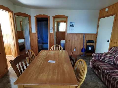 View of the dining area and the main living space of the cottage.