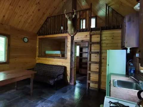 View of the main living area with kitchen, lounge area and mezzanine in the refuge.