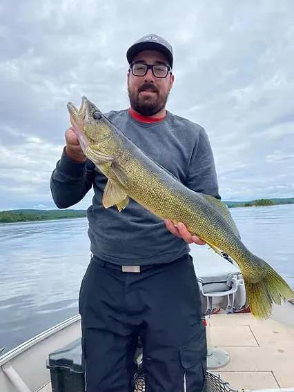 Angler with a nice catch on Lake Piscatosine at Pourvoirie Club Fontbrune, Laurentides, Quebec