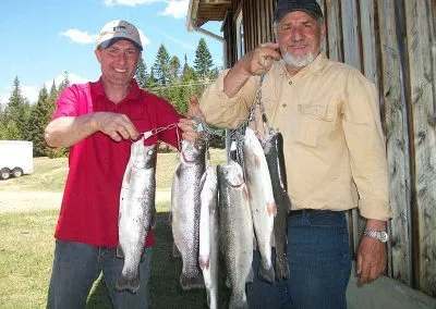 Angler presenting his trout catch at Pourvoirie Coin Lavigne, Lanaudière, Quebec