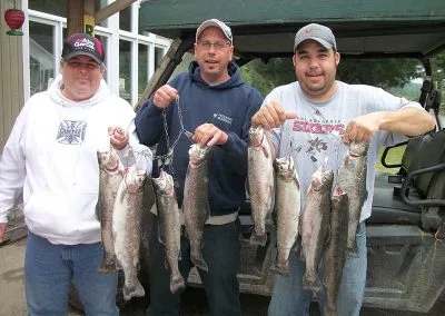 Showing off a beautiful trout caught during a stay at Pourvoirie Coin Lavigne, Lanaudière, Quebec