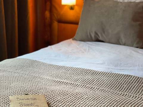A cozy room at the lodge welcomes guests with a small personalized touch.