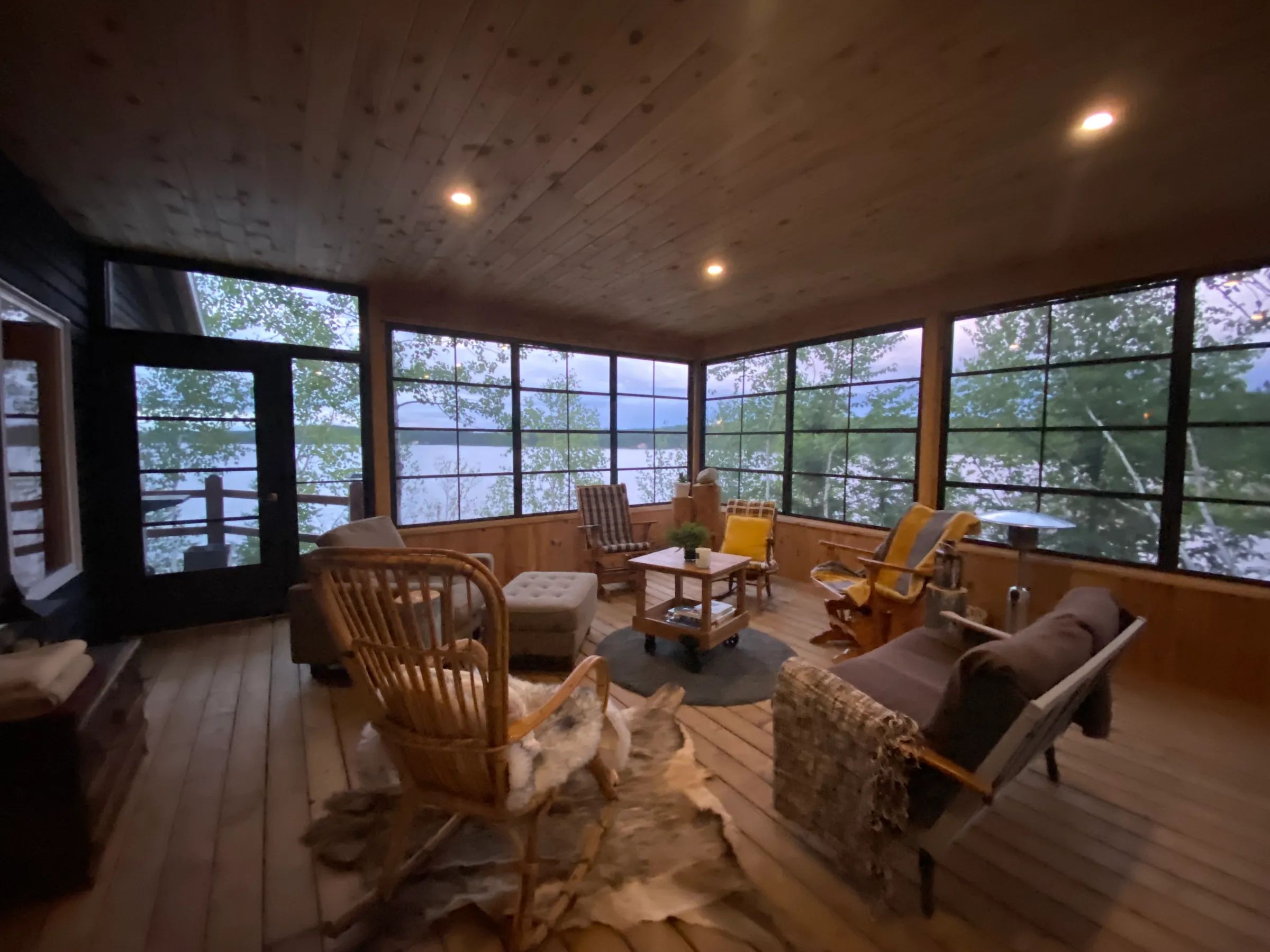 Relax in the inn's screened-in porch offering a soothing view of the lake.