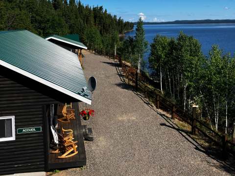 Overhead view of the cabin deck and its landscaped path along the lake.