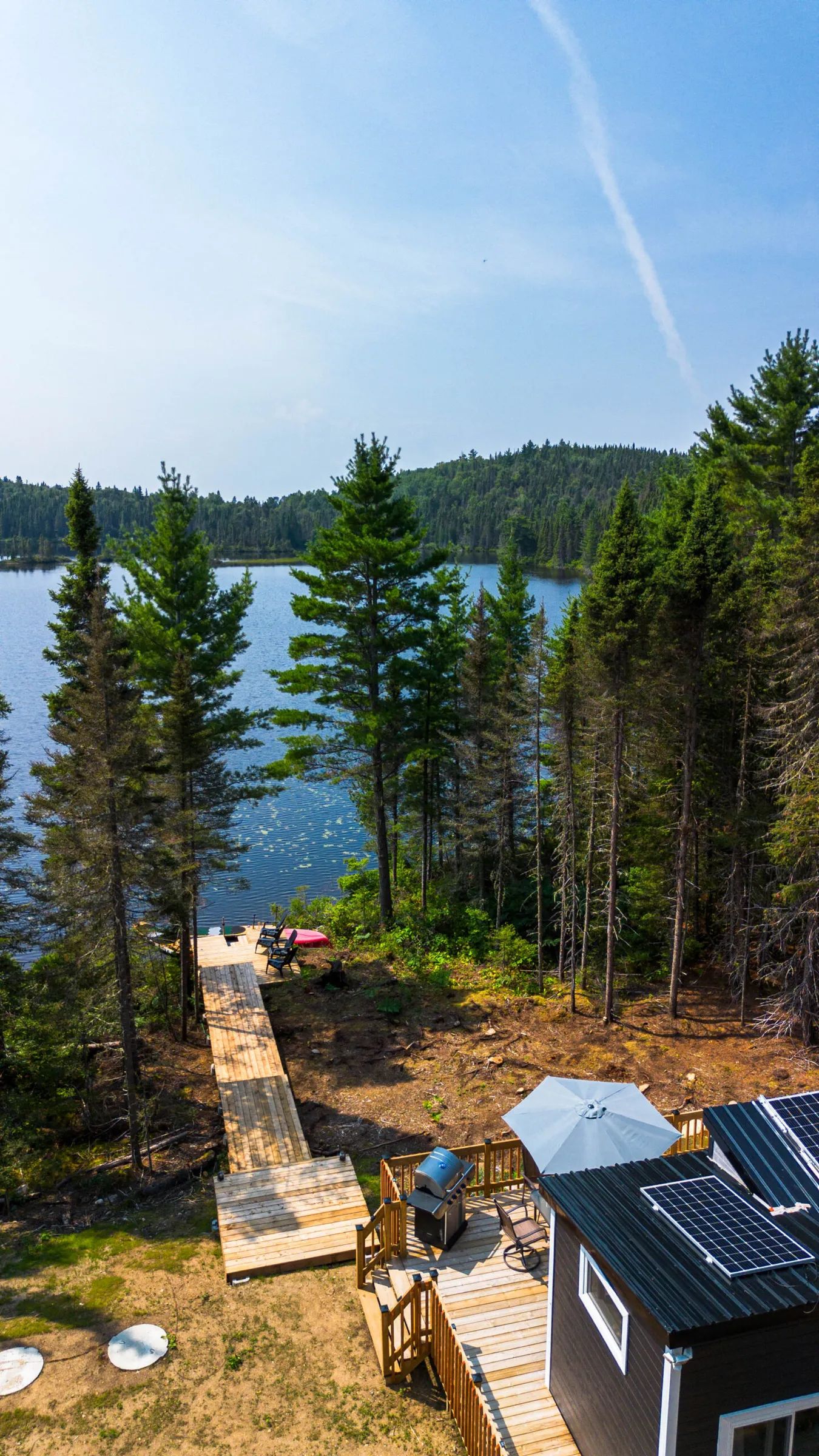 Overhead view of the private dock and the lake from the cabin's deck.