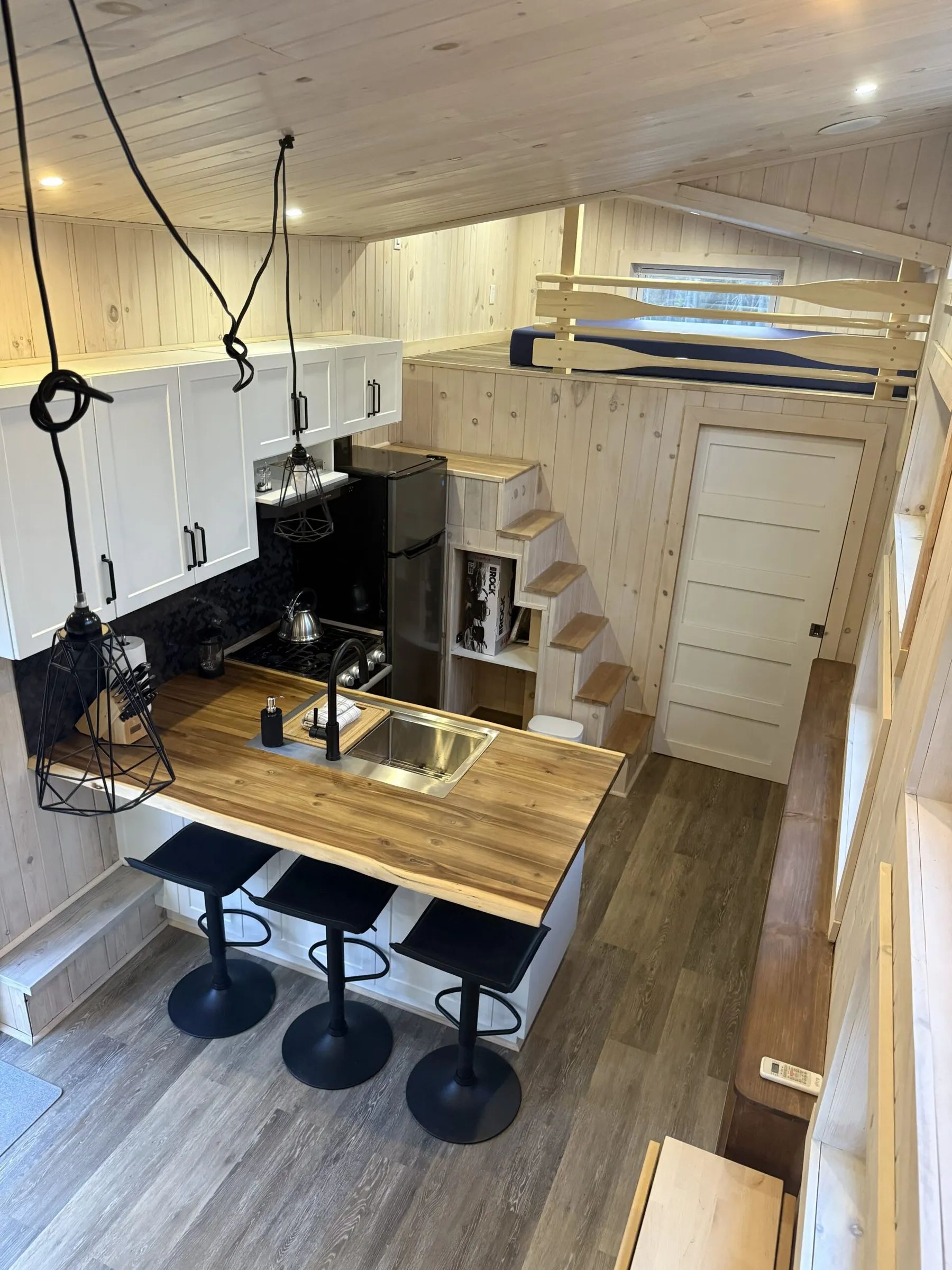 High-angle view of the functional kitchen and dining area in chalet 8.