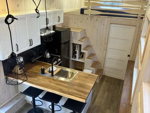 High-angle view of the functional kitchen and dining area in chalet 8.