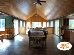 Overview of the open concept area featuring the dining room and living room of the Grizzly chalet.