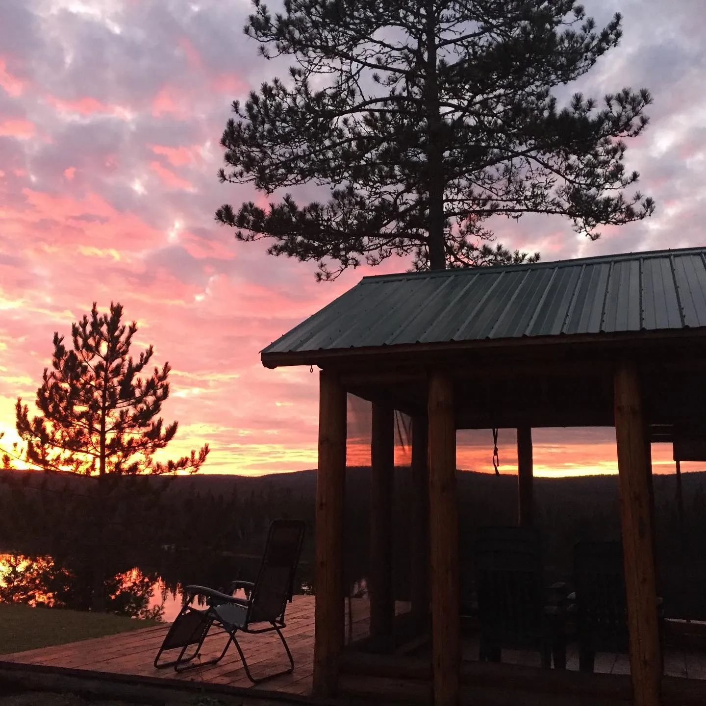 Enjoy a beautiful sunset from the chalet's screened porch.
