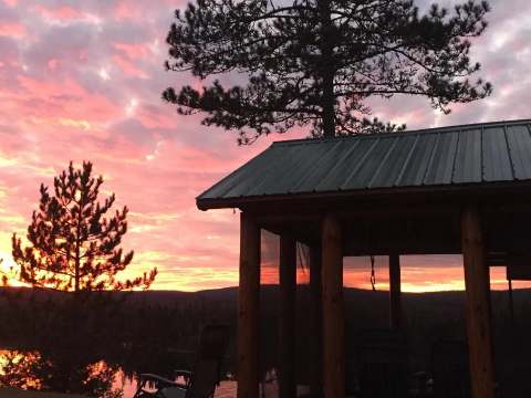 Enjoy a beautiful sunset from the chalet's screened porch.
