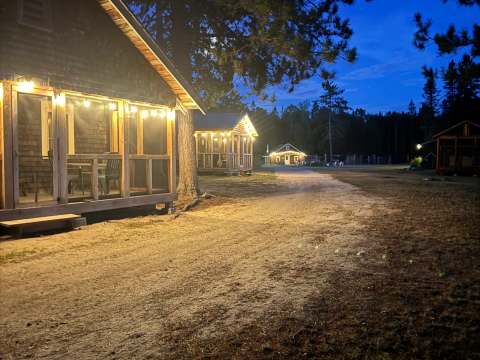 The cabins are illuminated at night at the outfitter.