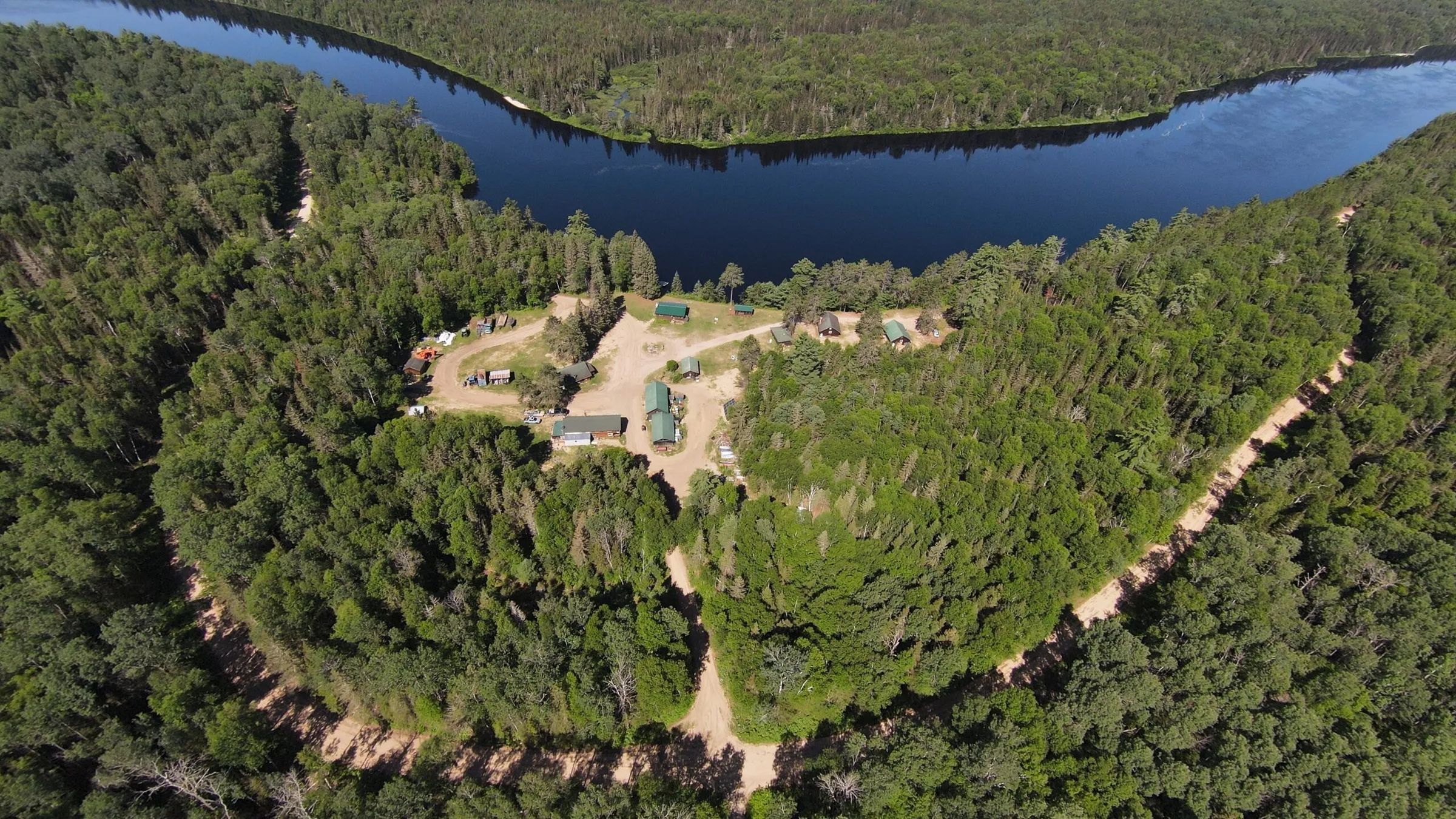 Aerial view of the cabins located along the river.