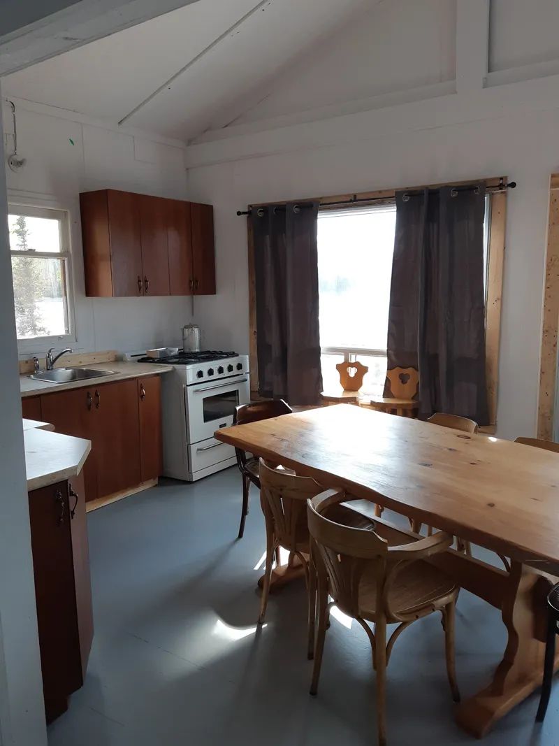 The functional kitchen and dining area of cabin 10.