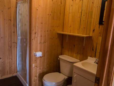 The South Pavilion bathroom features a shower, a toilet, and a sink.