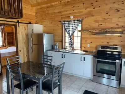 The equipped kitchen and open dining area offer all the comfort needed for your stay.