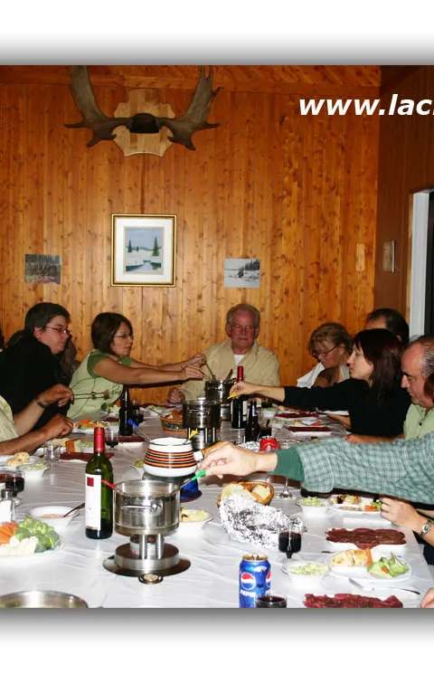 Dining - Group dinner after a day of snowmobiling at Pourvoirie du Lac Husky, Saguenay–Lac-Saint-Jean, Quebec