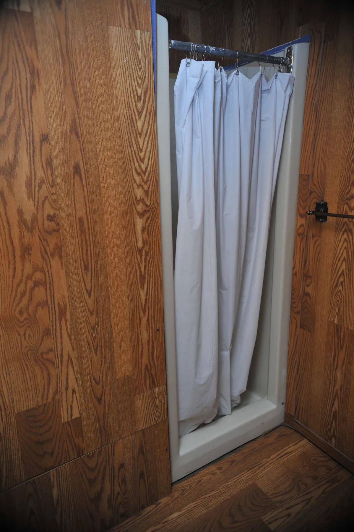 The shower stall is installed in the cabin's bathroom.