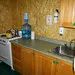 View of the L'Épervier cabin kitchen equipped with a stove and sink.