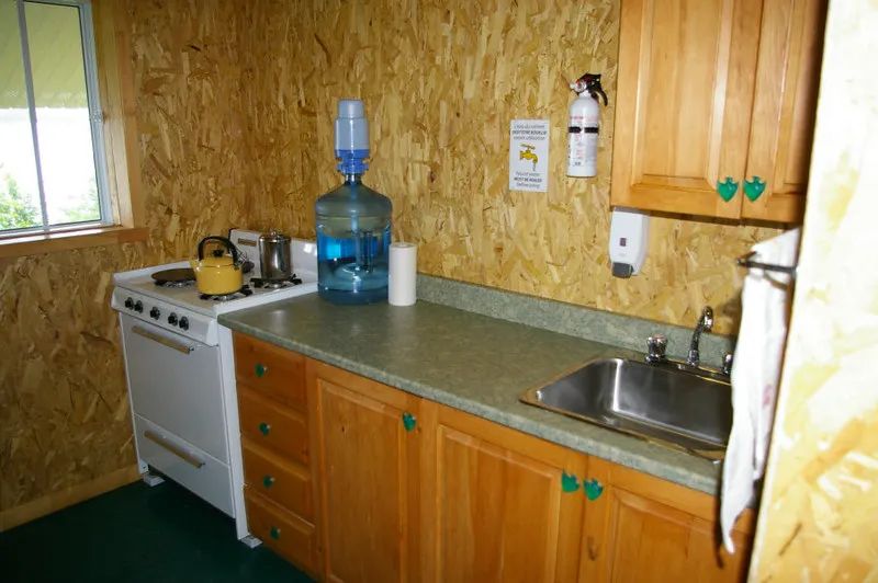 View of the functional kitchen in the L'Épervier cabin.