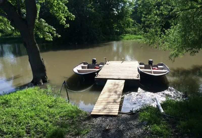 View of the L'Eau-Tel cabin with its private dock by the water.