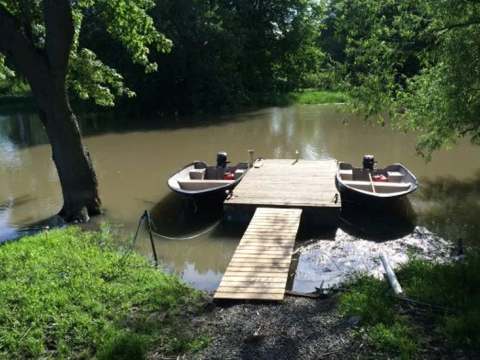 View of the L'Eau-Tel cabin with its private dock by the water.