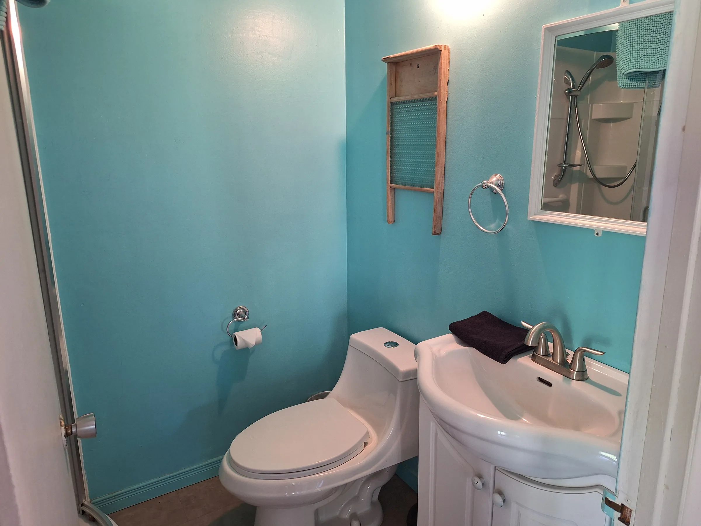 This functional bathroom is located inside the main cottage.