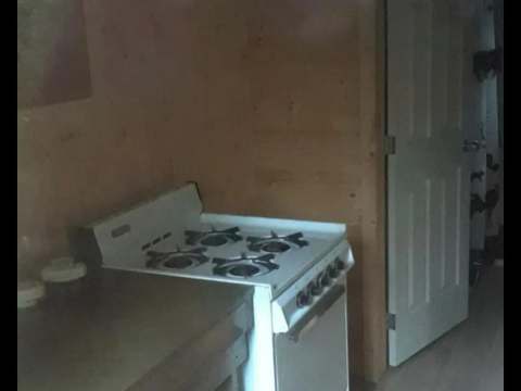 The stove is installed in the cabin's kitchen area.