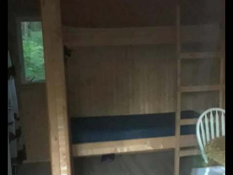 Interior view of the cabin featuring wooden bunk beds.