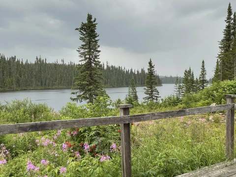 Peaceful view of the lake and forest from the chalet 3 deck.